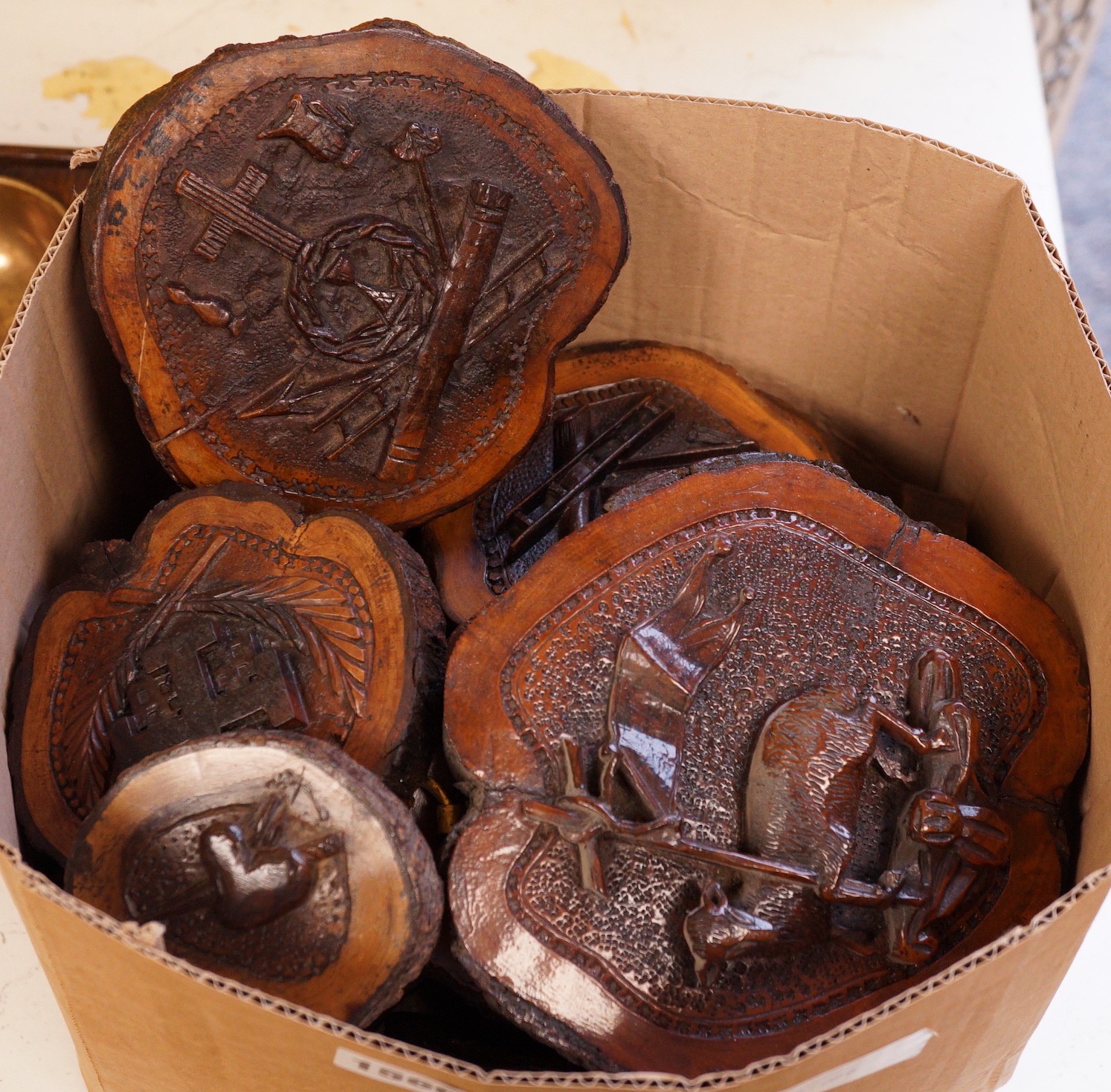 A collection of Jerusalem carved oyster olive wood roundels, religious and other symbolism